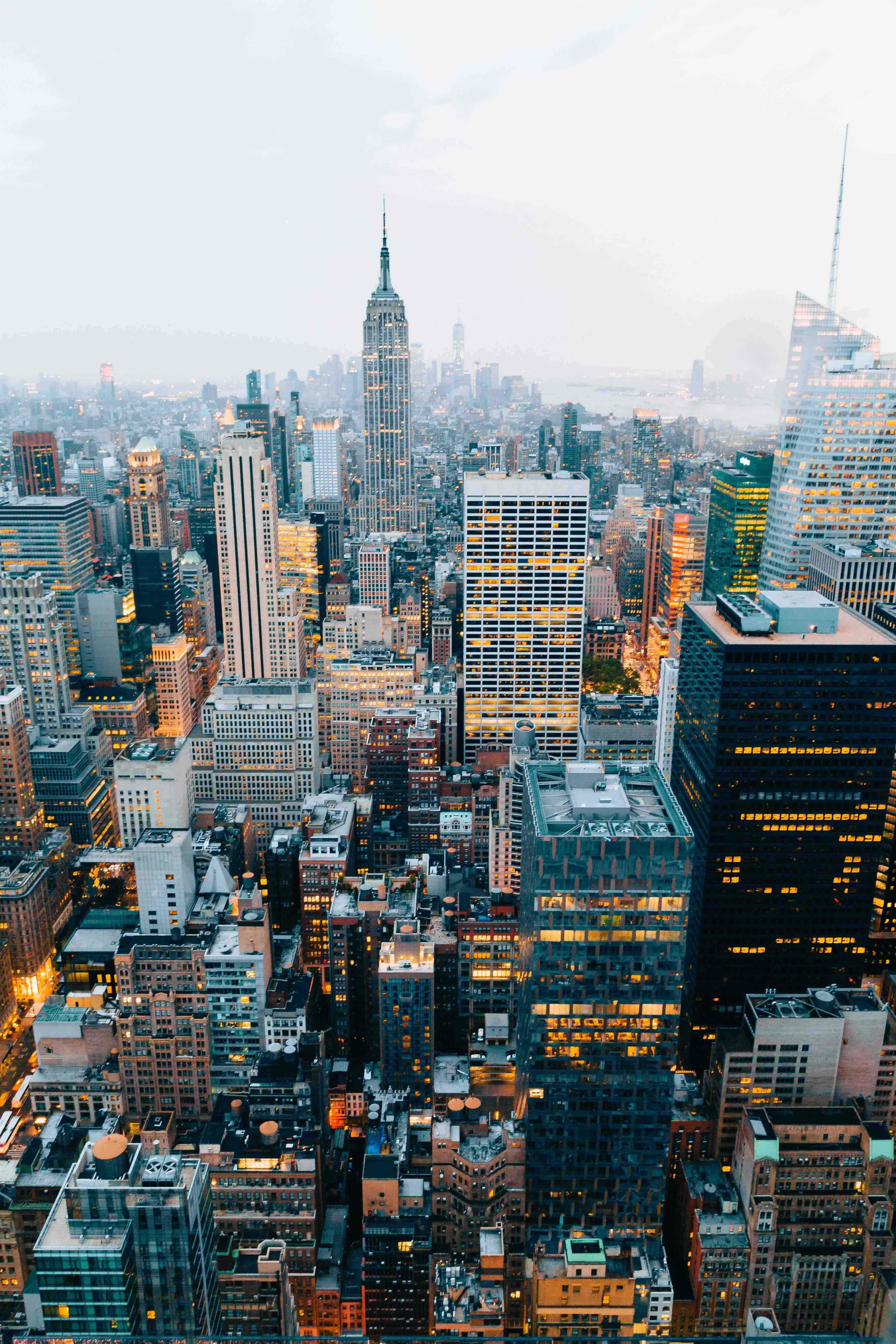 A classic photo of the New York City skyline taken at dusk from the Top of the Rock